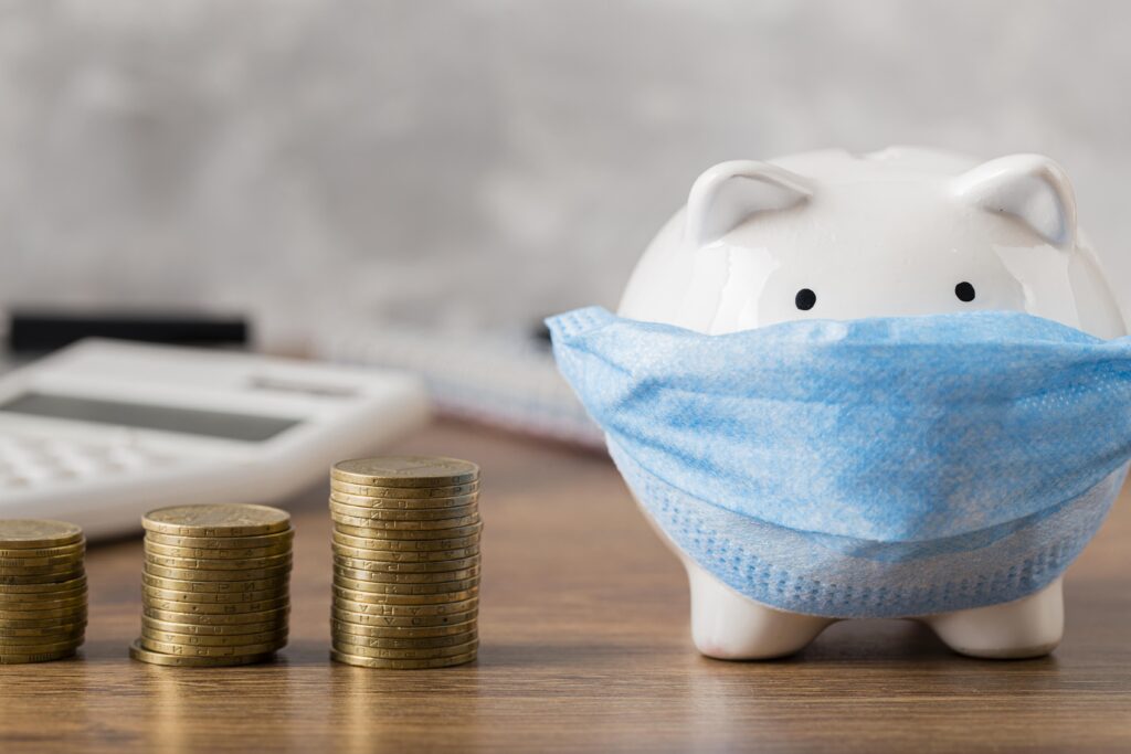 piggy bank with medical mask coins